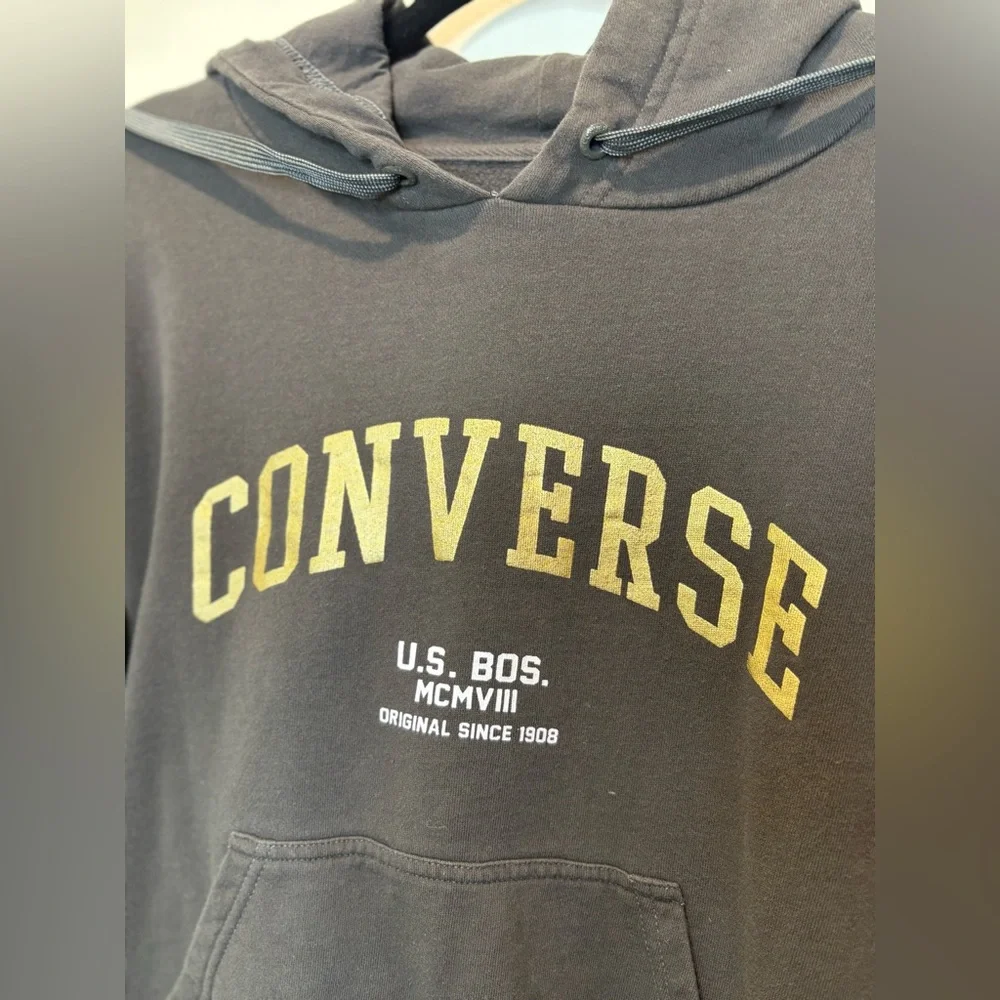 Converse Gold Standard Loose-Fit Pullover Hoodie in black with a gold logo.
